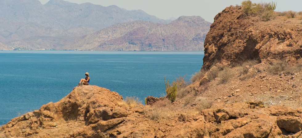 With mountains, sand, and water